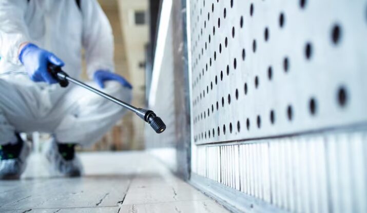 imgi_14_unrecognizable-person-white-chemical-protection-suit-doing-disinfection-public-areas-stop-spreading-highl